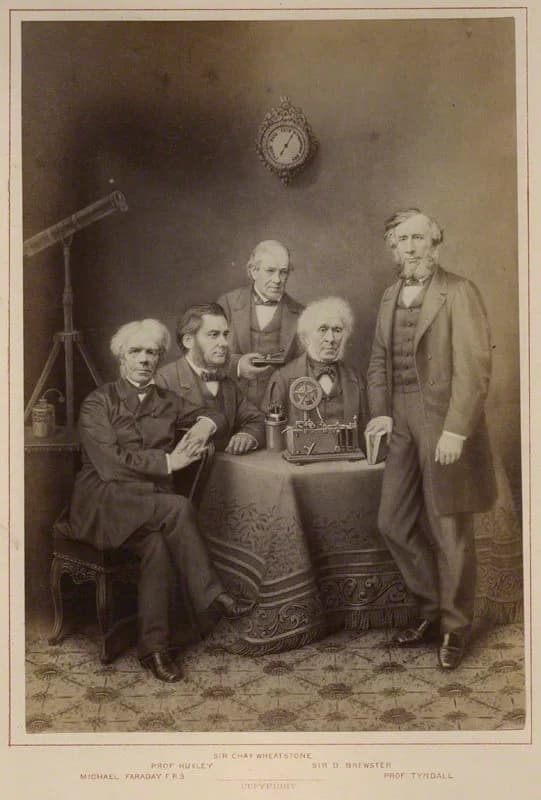 John Tyndall - Photograph of (left to right): Michael Faraday, Thomas Henry Huxley, Charles Wheatstone, David Brewster, John Tyndall. Published by Hughes &amp; Edmonds, albumen print, published 1876.