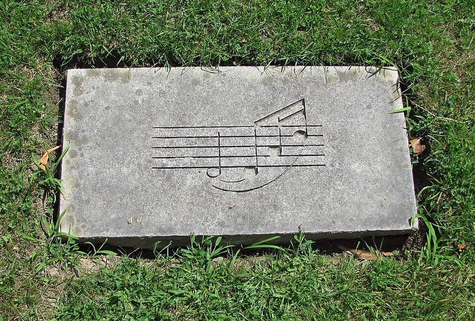 Aaron Copland - This is one of the stones in memory of Aaron Copland, whose ashes were spread in a bower at Tanglewood Music Center. Whether it was intentional that the notes spell "Dad" or just coinc