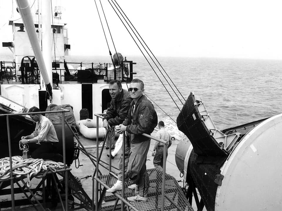 Frank Borman - NASA photo showing backup astronauts James Lovell (left) and Frank Borman aboard the MV Retriever.
