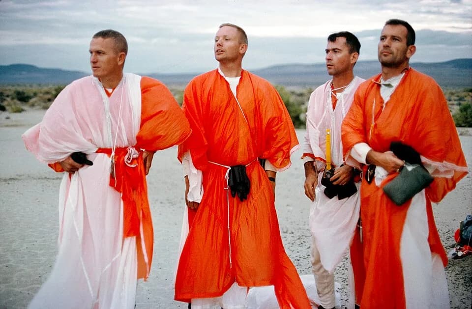 Frank Borman - Description (Aug. 13, 1964) Astronaut John Young, Frank Borman and Neil Armstrong with Deke Slayton are shown during desert survival training at Stead AFB, Reno, Nevada.