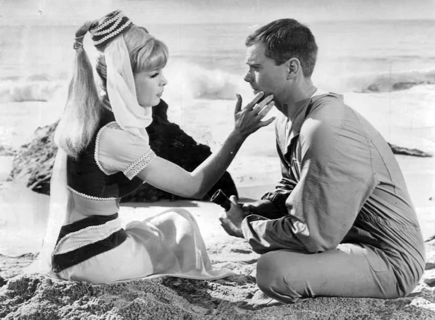 Larry Hagman - Publicity photo of Larry Hagman and Barbara Eden  from I Dream of Jeannie.
