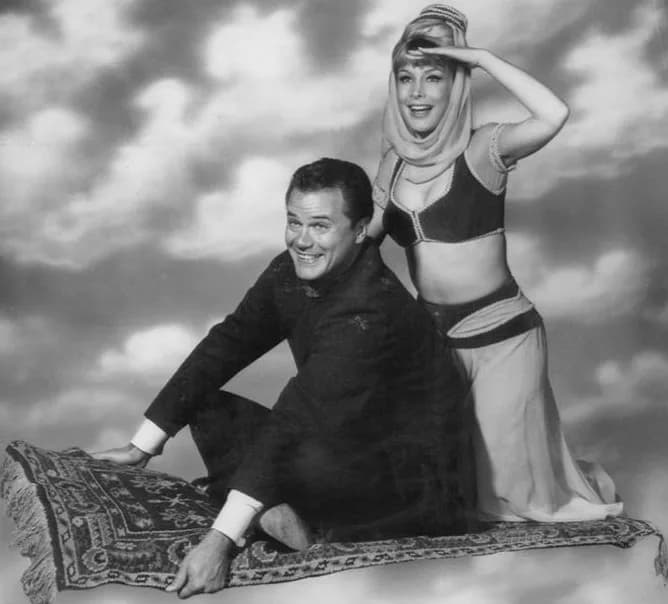 Larry Hagman - Publicity photo of Larry Hagman and Barbara Eden  from I Dream of Jeannie.