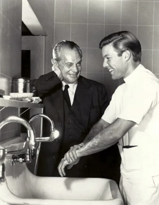 Richard Chamberlain - Publicity photo announcing the premiere of the television program Dr. Kildare.  Raymond Massey is Dr. Gillespie and Richard Chamberlain is Dr. Kildare, shown scrubbing up.