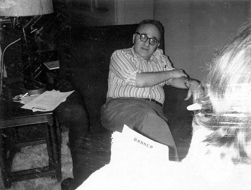 Murray Rothbard - Rothbard sitting in his living room