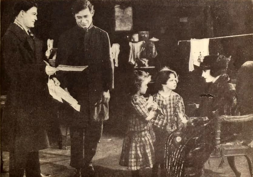 Will Rogers - Still from the American film A Poor Relation (1921) with Will Rogers, Wallace MacDonald, and Sylvia Breamer, and child actors Robert DeVilbiss and Jeanette Trebaol, on page 37 of the Nov