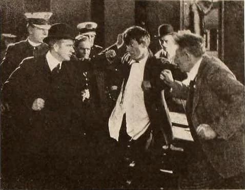 Will Rogers - Still from the American film The Strange Boarder (1920) with Will Rogers, page 2953 of the March 27, 1920 Motion Picture News.