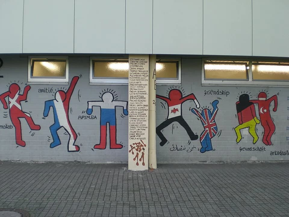 Keith Haring - Happy people from different nations celebrating friendship.