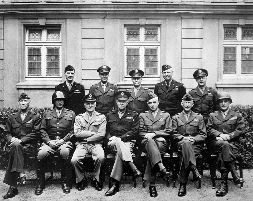 Omar Bradley - Senior American commanders of the European theater of World War II.  
Seated are (from left to right) Gens. William H. Simpson, George S. Patton, Carl A. Spaatz, Dwight D. Eisenhower, O