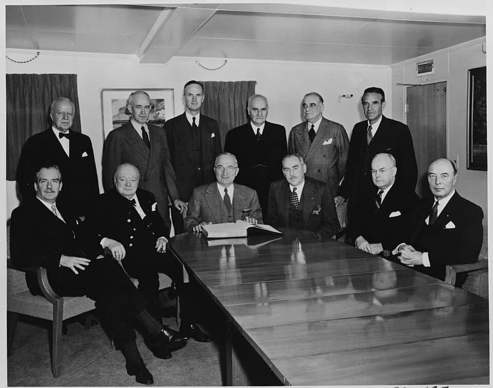 Omar Bradley - Photograph of participants in a conference aboard President Truman's yacht, the U.S.S. WILLIAMSBURG, (seated, left to... - NARA - 199026.jpg