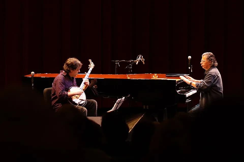 Chick Corea - Banjoist Béla Fleck plays bluegrass while pianist Chick Corea accompanies him by tapping on the piano, during the encore of a joint performance at the Hopkins Center at Dartmouth College