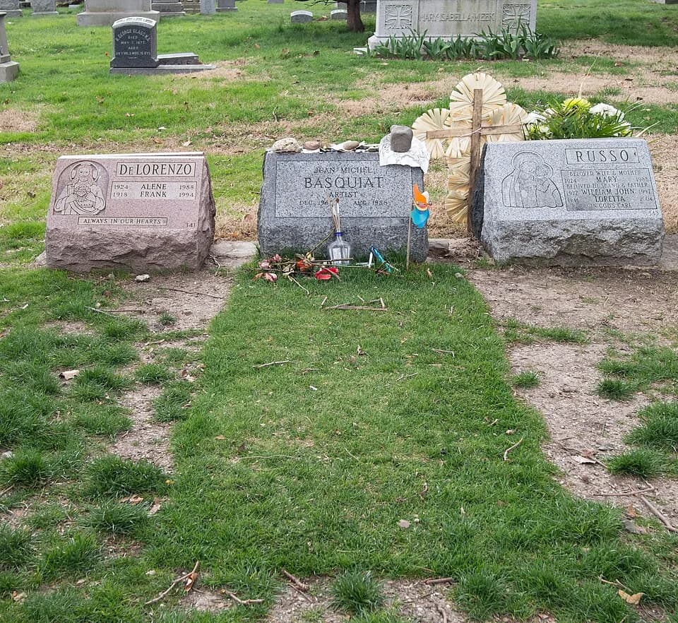 Jean-Michel Basquiat - Burial site of Jean-Michel Basquiat in Green-Wood Cemetery, covered in mementos.