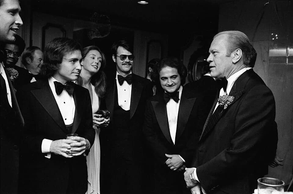 John Belushi - President Gerald R. Ford Talking with Chevy Chase, Saturday Night Live Producer Lorne Michaels, John Belushi, Dan Aykroyd, and Others at the 32nd Annual Radio and Television Corresponde