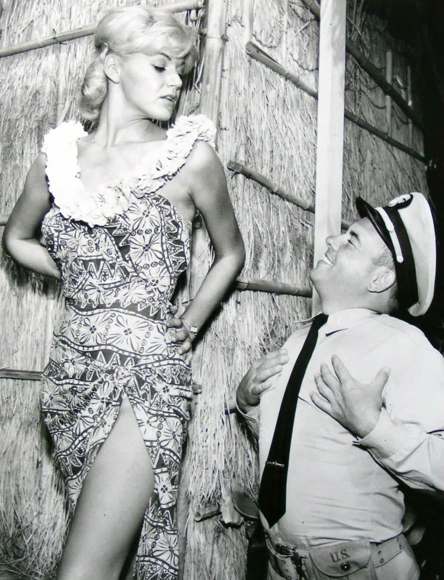 Tim Conway - Publicity photo from the television program McHale's Navy.  Pictured are Rochelle Rac and Tim Conway as Ensign Parker at "McHale's Paradise Hotel".