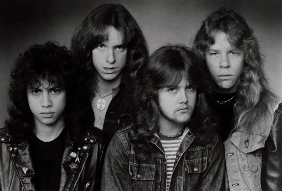 Cliff Burton - Metallica in a press photo dated to 1983. Photo is definitely pre-1989, as Metallica left Megaforce and signed to Elektra in 1984. No copyright markings on the photo and no registration