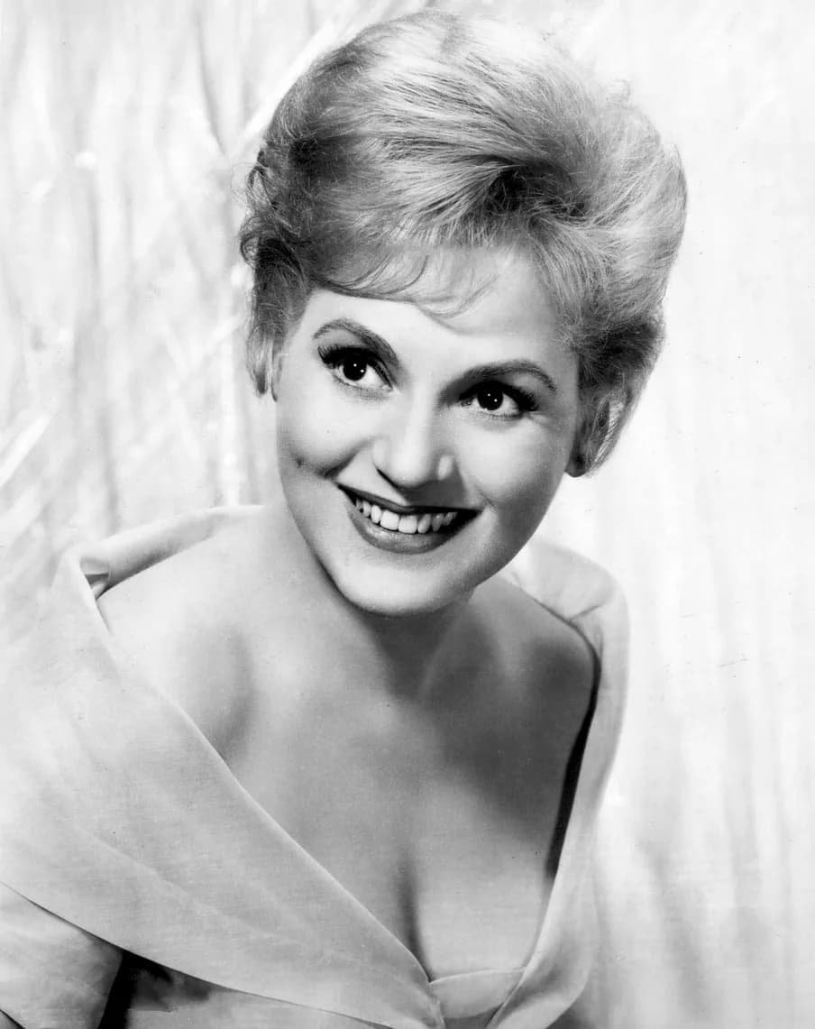 Judy Holliday - Photo of Judy Holliday.
The item has no copyright markings on it as can be seen in the links above.
United States Copyright Office page 2 "Visually Perceptible Copies The notice for vi