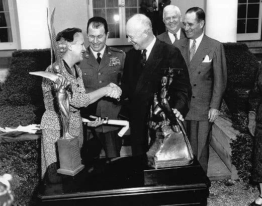 Chuck Yeager - Jackie Cochran and Chuck Yeager being presented with the Harmon International Trophies by President Dwight D. Eisenhower. (Photo courtesy Air Force Flight Test Center History Office)