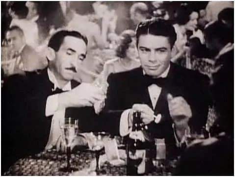 Paul Muni - Osgood Perkins (left) &amp; Paul Muni - cropped screenshot from the trailer for the 1932 film Scarface.