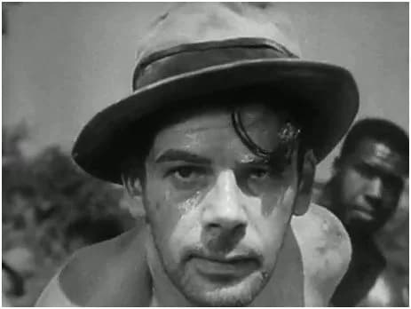 Paul Muni - Cropped screenshot from the trailer for the film I am a Fugitive from a Chain Gang (1932).