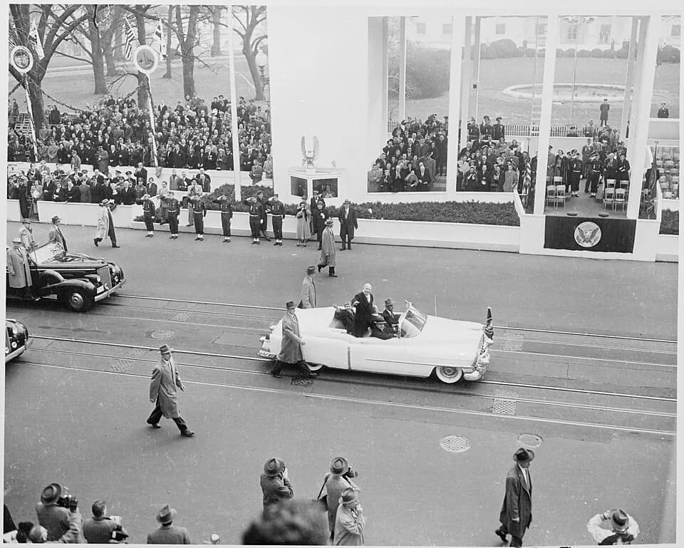 Mamie Eisenhower - Photograph of President Dwight D. Eisenhower and First Lady Mamie Eisenhower waving to crowds as they ride in the... - NARA - 200425.jpg