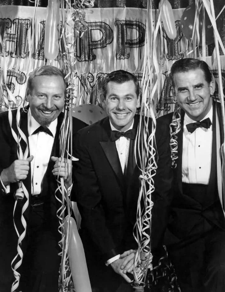 Johnny Carson - Publicity photo of the cast of the television program The Tonight Show as it prepared to celebrate 1963 with its new host, Johnny Carson.  From left: bandleader Skitch Henderson, Johnn