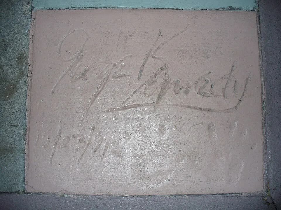 George Kennedy - This photo depicts the handprints of George Kennedy in front of The Great Movie Ride at Walt Disney World's Disney's Hollywood Studios theme park.