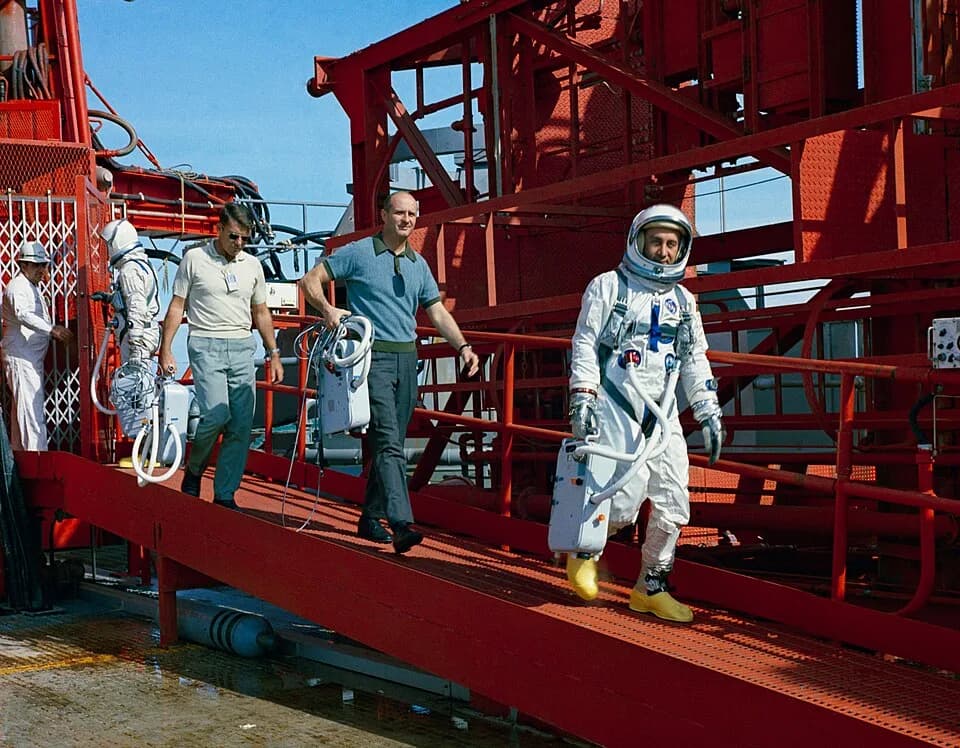 John Young - Astronauts John W. Young, Walter M. Schirra Jr., Thomas P. Stafford and Virgil I. Grissom (left to right) are shown during egress training during Gemini-Titan 2 simulation launch at Pad 1