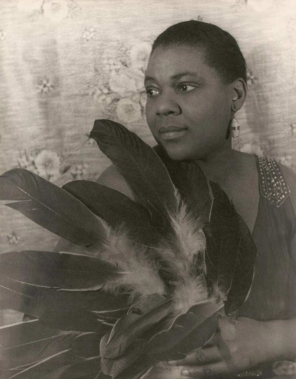 Bessie Smith - Portrait of Bessie Smith holding feathers
