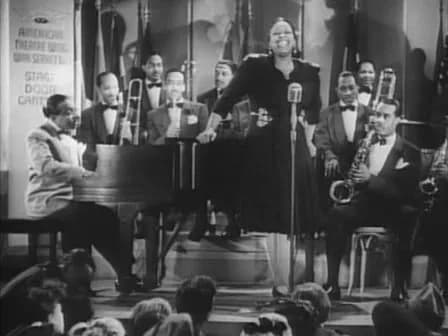 Count Basie - Cropped screenshot of Count Basie and his band with featured vocalist Ethel Waters from the film Stage Door Canteen.