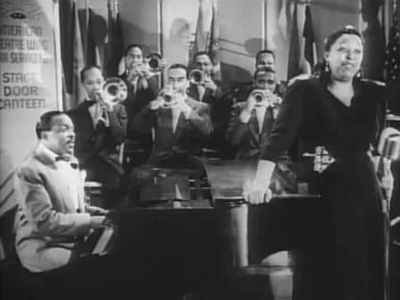 Count Basie - Cropped screenshot of Count Basie and his band with featured vocalist Ethel Waters from the film Stage Door Canteen.