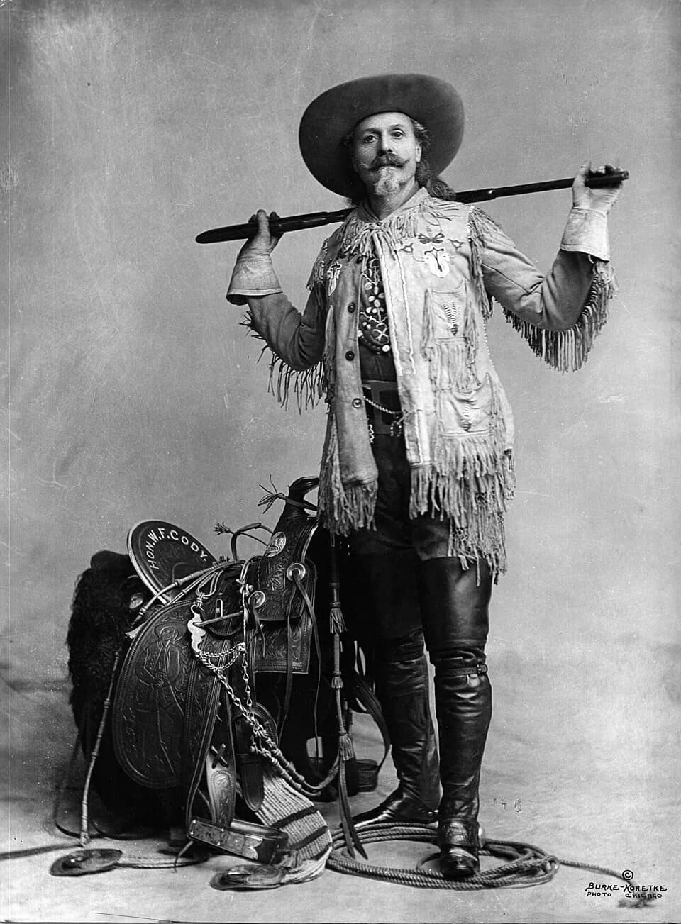 Buffalo Bill - Buffalo Bill Cody with a rifle across both shoulders.
