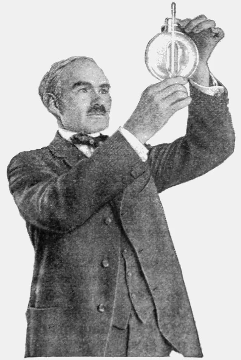Lee de Forest - Picture of American electrical engineer Lee De Forest, who invented the amplifying vacuum tube in 1906, with one of his early tubes, which he called Audions, from an article in Popular