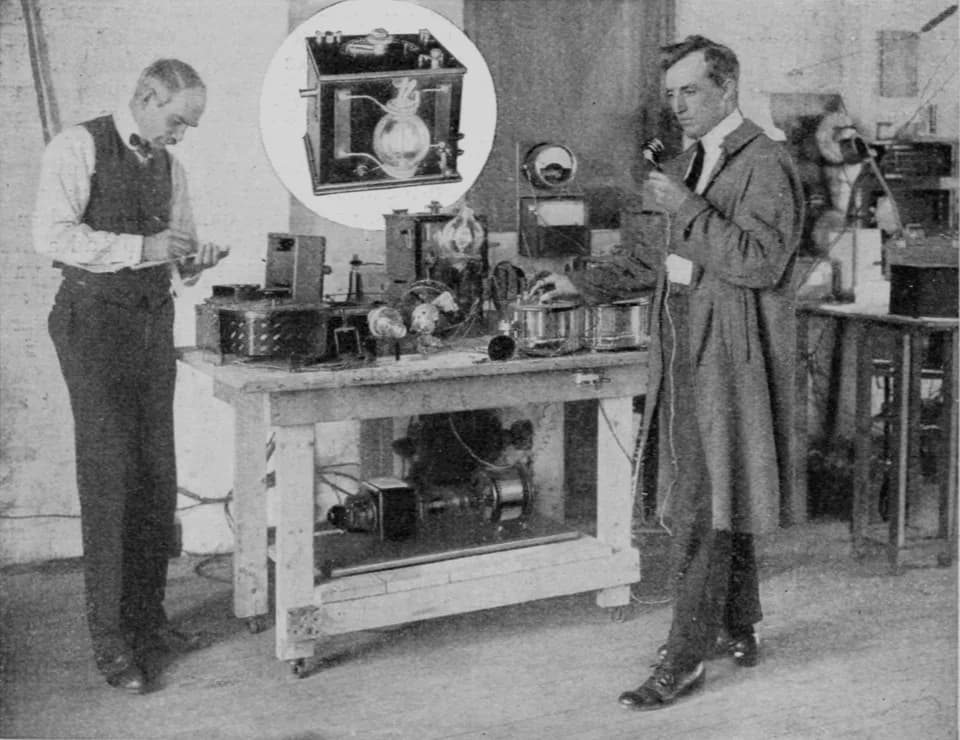 Lee de Forest - Inventor Lee De Forest (left) and another man experimenting with an early AM radio transmitter using his audion vacuum tube.  The Audion tube (inset, top), the first triode, invented b