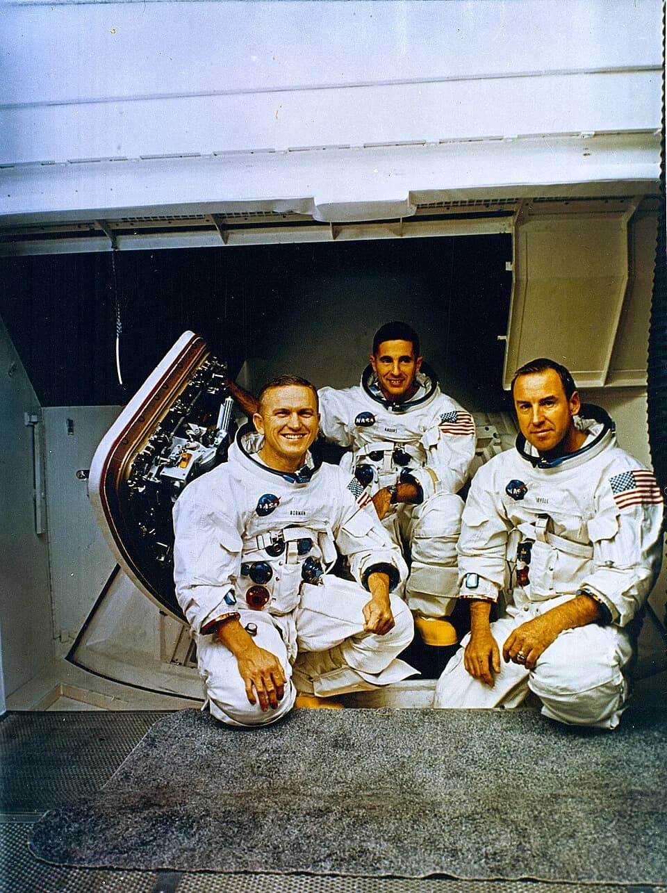 Bill Anders - The Apollo 8 Crew (L to R) Frank Borman, commander; William Anders, Lunar Module (LM) Pilot; and James Lovell, Command Module (CM) pilot pose in front of the Apollo mission simulator dur