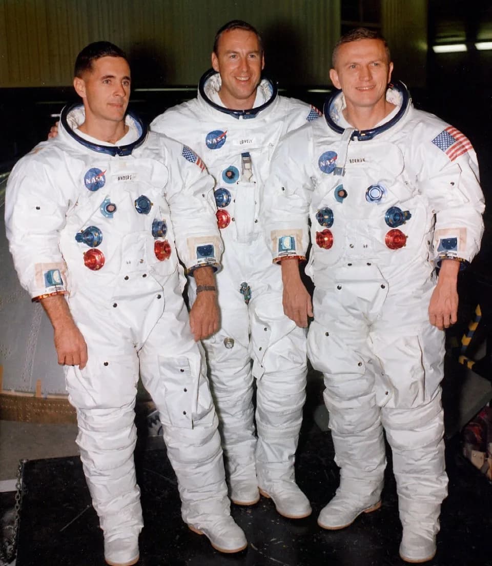 Bill Anders - The crew of Apollo 8 in front of a simulator:From left to right: Bill Anders, Jim Lovell, Frank Borman