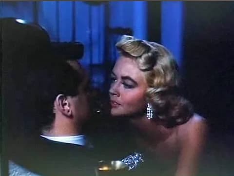 Dorothy Malone - Screenshot of Rock Hudson and Dorothy Malone from the trailer for the film w:en:Written on the Wind