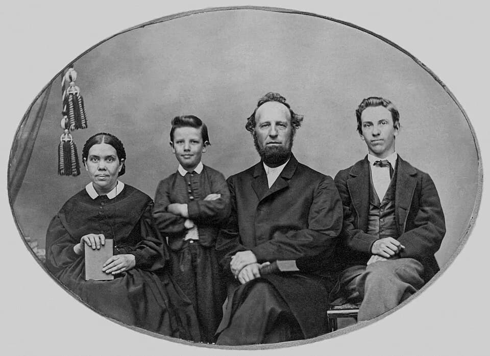 Ellen G. White - James and Ellen White family portrait.From left to right: Ellen G. White ― William C. White ― James S. White ― James E. White