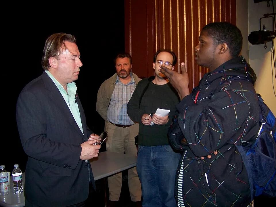 Christopher Hitchens - Christopher Hitchens speaks with a student after an event at The College of New Jersey.