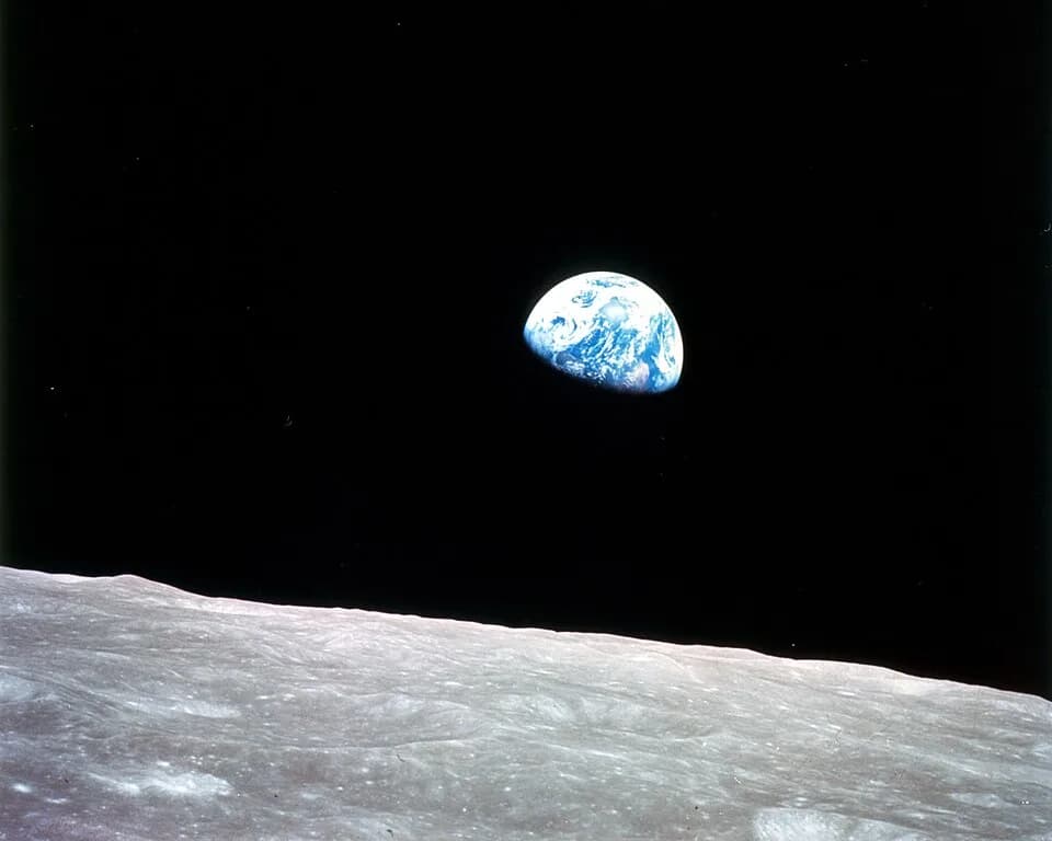 Fred Hoyle - This view of the rising Earth greeted the Apollo 8 astronauts as they came from behind the Moon after the fourth nearside orbit. Earth is about five degrees above the horizon in the photo
