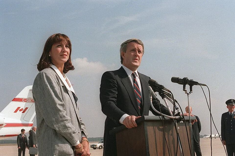 Brian Mulroney - Canadian Prime Minister Brian Mulroney bids farewell to dignitaries after a state visit. Mulroney is accompanied by his wife, Mila. Location: Andrews Air Force Base, Maryland, United 