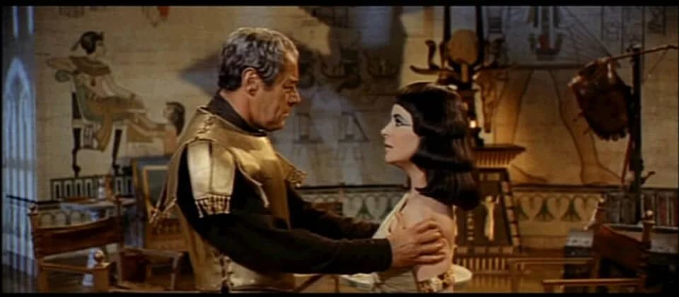 Rex Harrison - Screenshot of Rex Harrison and Elizabeth Taylor from the trailer for the film Cleopatra.