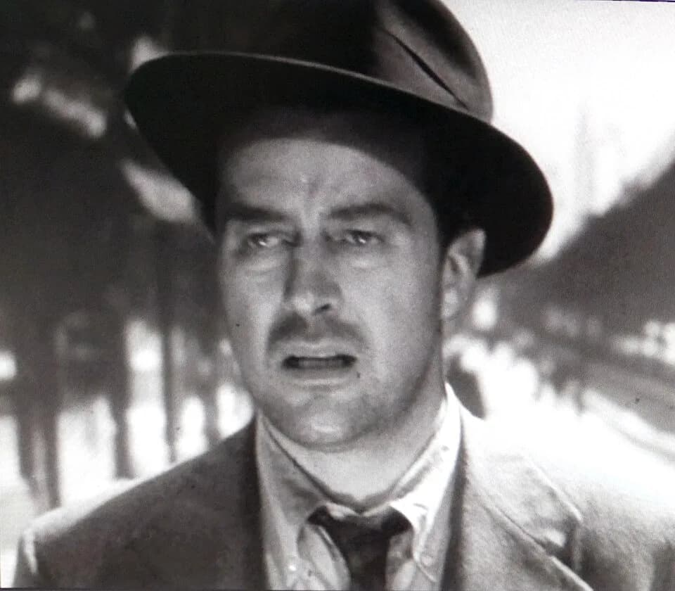 Ray Milland - Cropped screenshot with Ray Milland from the trailer for the American film The Lost Weekend (1945) showing Third Avenue El in the background.