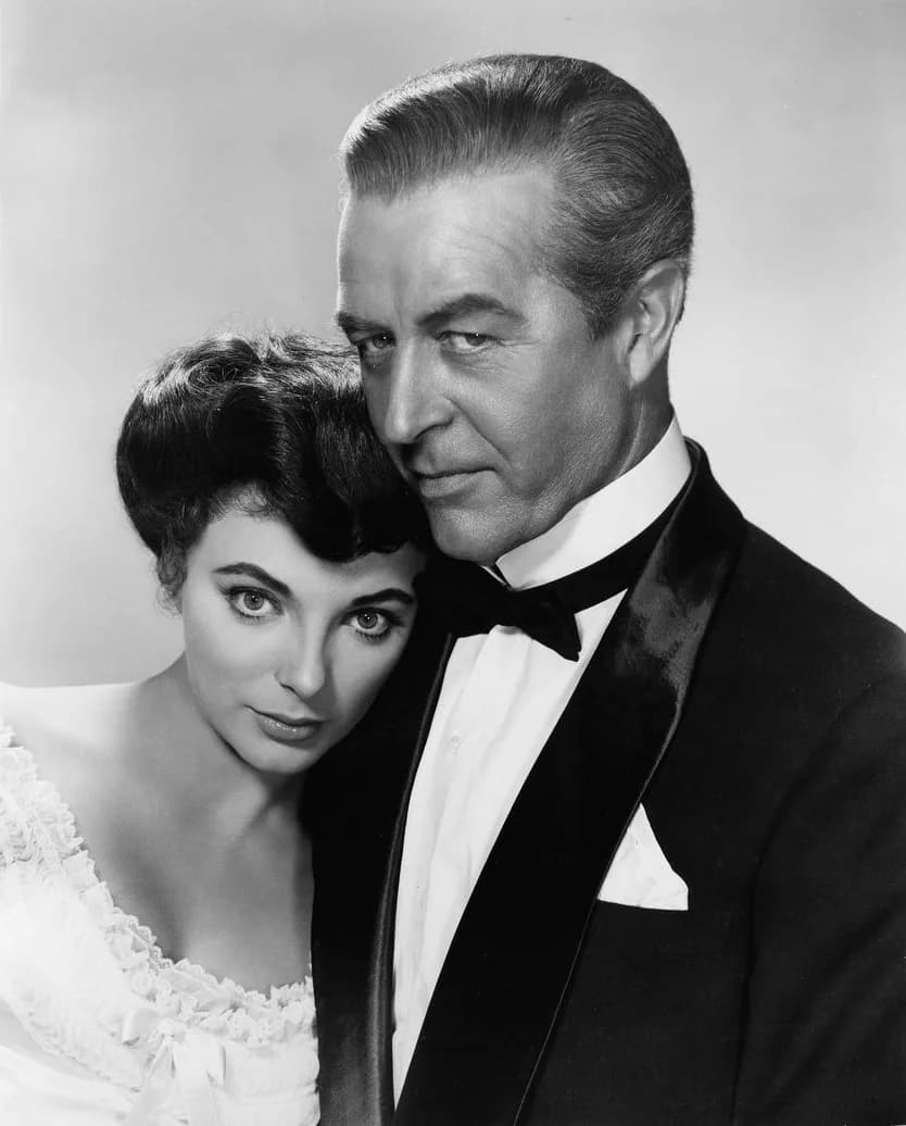 Ray Milland - Photo of Joan Collins and Ray Milland from the film The Girl in the Red Velvet Swing.