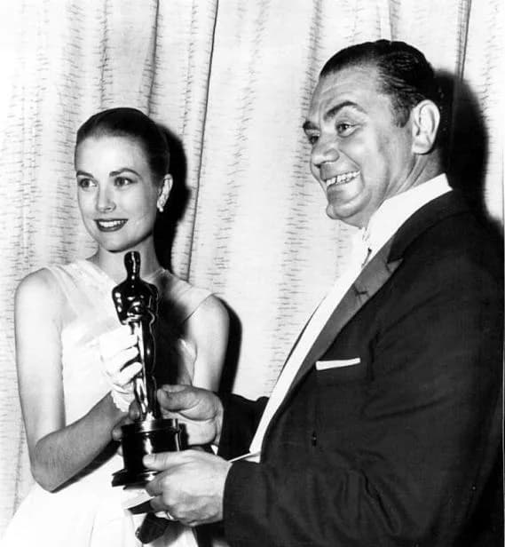 Ernest Borgnine - Photo of Ernest Borgnine receiving academy award for Marty from Grace Kelly
