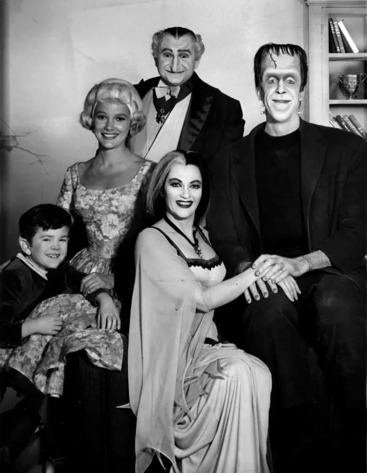 Yvonne De Carlo - Publicity photo of the cast of the television program The Munsters.  Seated, from left: Butch Patrick (Eddie), Yvonne DeCarlo (Lilly), Fred Gwynne (Herman).  Standing: Beverly Owen (