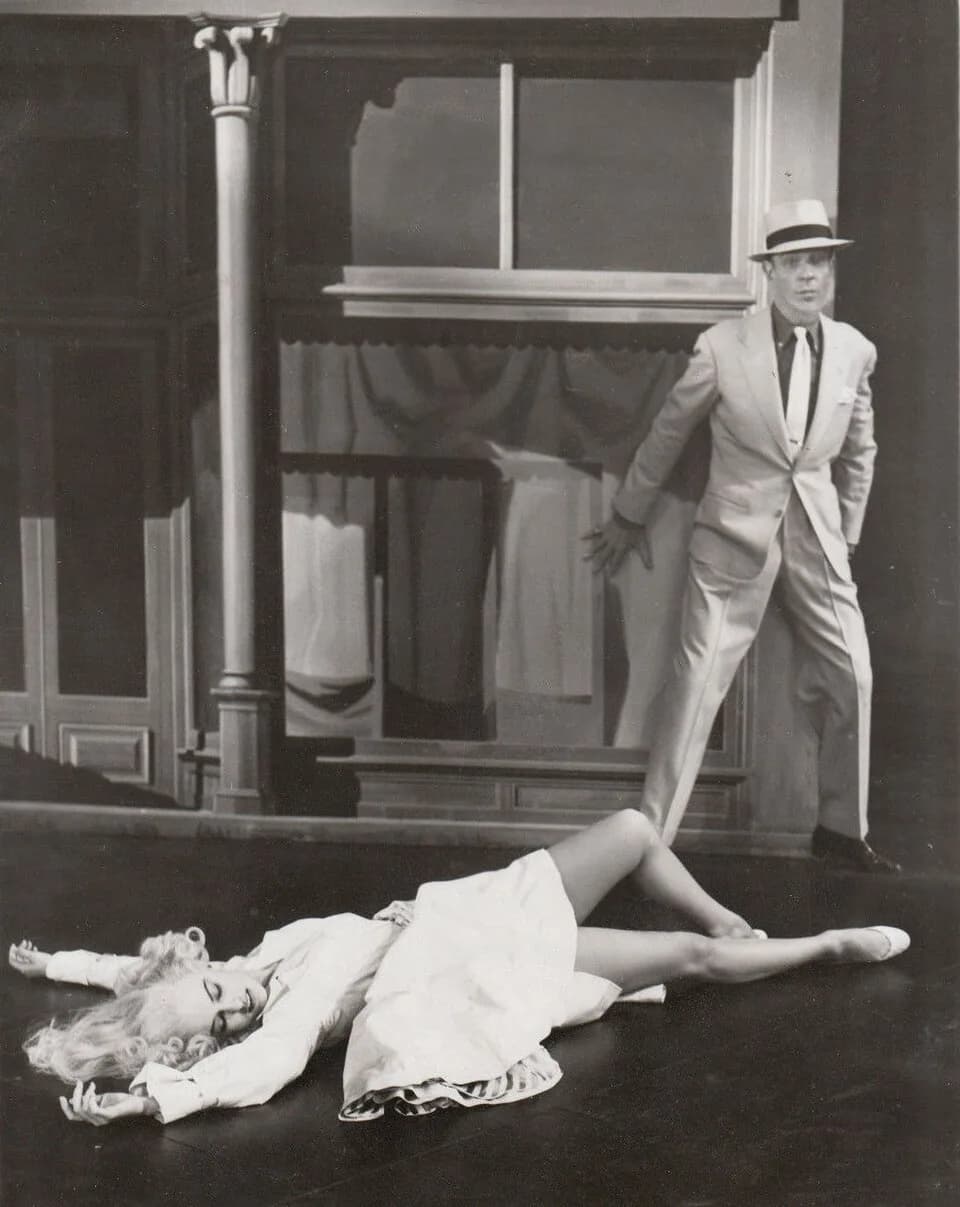 Cyd Charisse - Still from MGM musical "The Band Wagon" (1953), scene from "Girl Hunt Ballet." No copyright notice on either side of photo