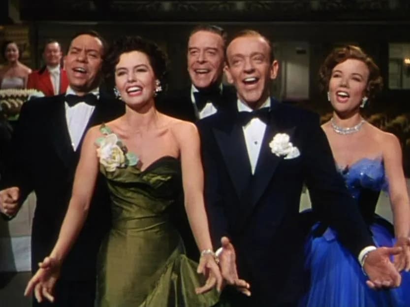 Cyd Charisse - L. to R. : Oscar Levant, Cyd Charisse, Jack Buchanan, Fred Astaire &amp; Nanette Fabray (final number That's Entertainment!) in The Band Wagon - trailer (cropped screenshot)