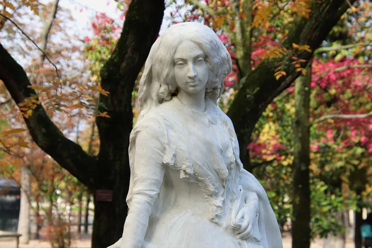 George Santayana — sculpture, stone statue, character, writer, george sand, famous, tribute, public garden, literature, story, nature, culture, art, woman, head, beautiful, tree, fall foliage, autumn colors, lights of autumn