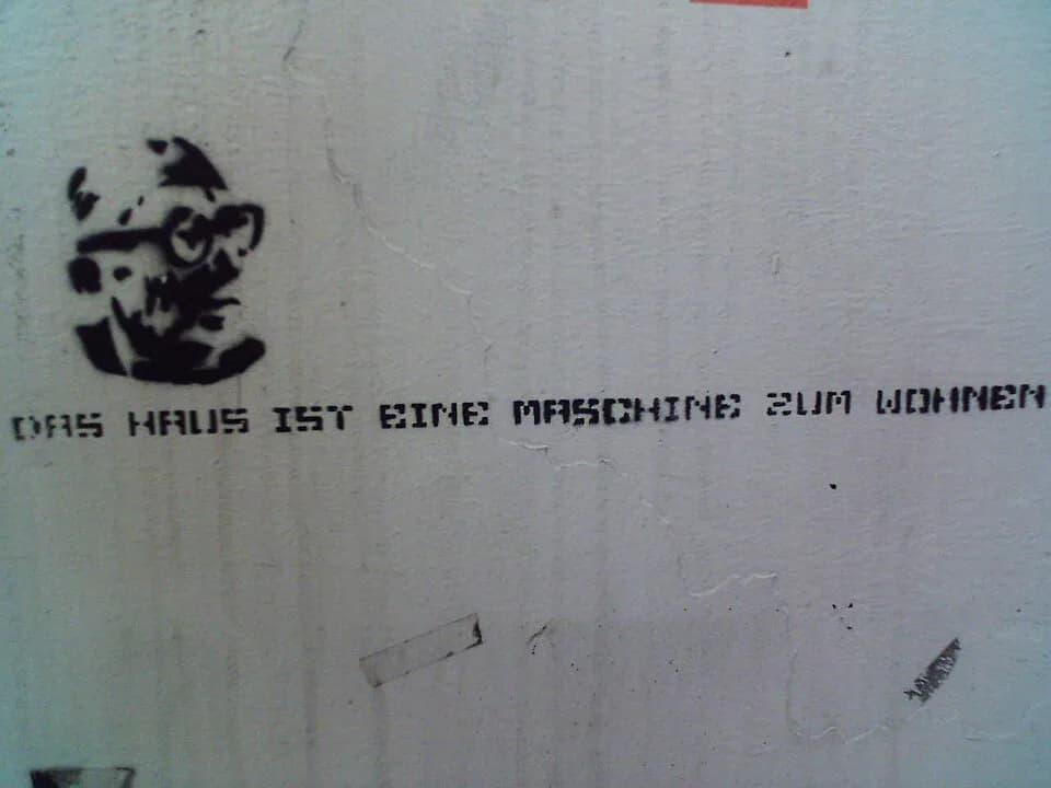 Le Corbusier - foto of this pochoir/stencil taken by myself in linz on september 28, 2005.
This quote is from the architect "Le Corbusier" and means "The House is a machine to live in" (probably it g