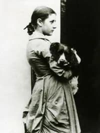 Beatrix Potter - A photograph of Beatrix Potter, aged 15, taken by her father. Beatrix is holding her dog, Spot. From the National Trust.