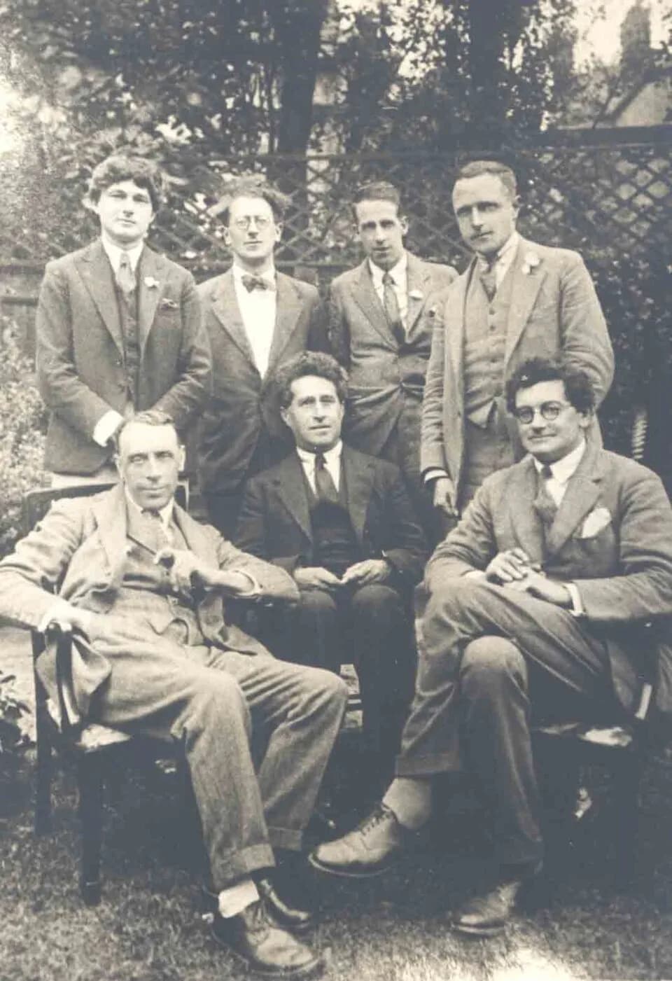 A. A. Milne - Standing, left to right: Mark Gertler, Hewy Levy, Walter J. Turner, Alan Alexander Milne. Seated, left to right: Ralph Hodgson, S. S. Koteliansky and J.W.N. Sullivan
